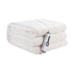 a stack of white towels with a hair dryer on the top and two folded ones