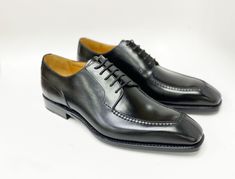 Style: 20141-2002-Black Simple, Elegant, Stunning! Completely Handmade, this Hand Burnished lace-up oxford from the Ugo Vasare collection features Goodyear Welted construction, soft Calfskin lining, cushioned insole, Split-Toe, a stitched welt and a full Leather sole! Matching Belt Available. Don't see your size? This style may be special ordered. Elegant Fitted Derby For Semi-formal Occasions, Classic Fitted Oxfords With Laces, Elegant Fitted Oxfords With Laces, Designer Fitted Oxfords For Business, Elegant Formal Oxfords With Laces, Elegant Goodyear Welted Lace-up Derby Shoes, Elegant Goodyear Welted Lace-up Derby, Elegant Business Lace-up Derby Shoes, Elegant Oxfords With Laces For Derby