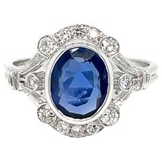 an oval blue sapphire and diamond ring