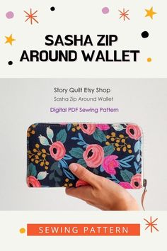 a hand holding a purse with flowers on it and the words saha zip around wallet