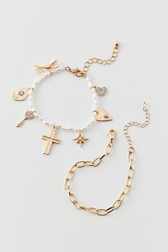 Set of two bracelets to make your own stack. Features Larsa charm bracelet set Set of two coordinating bracelets Chain and pearl bracelet silhouettes Charm detailing Clasp closure Content + Care Set of 2 Mixed metal, acrylic Avoid contact with water Imported Size Dimensions: 7.5" l | Larsa Charm Bracelet Set in Gold, Women's at Urban Outfitters Trendy Urban Outfitters Jewelry As Gift, Bracelets To Make, Bracelets Chain, Men's Shoes Accessories, Women Men Shoes, Mixed Metals, Pearl Bracelet, Bracelet Set, Color Coding