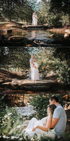 a couple standing next to each other in front of a river and surrounded by trees