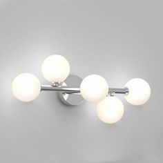 three light bathroom fixture with white glass balls