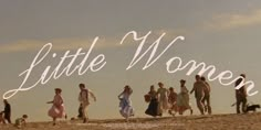 a group of people walking on top of a sandy beach next to the words little women