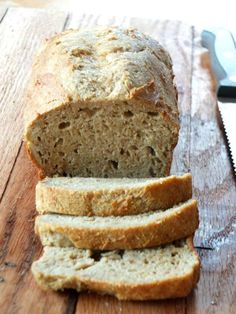 a loaf of bread sitting on top of a wooden cutting board