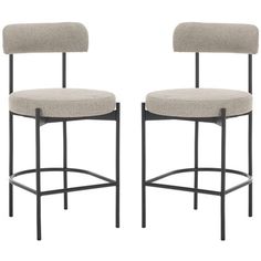 a pair of chairs with grey upholstered backrests and black metal legs