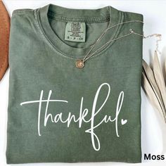 Thankful Shirt, Comfort Colors, Cute Fall Shirt, Thanksgiving Shirt, Halloween Gift, Family Thanksgiving Shirts, Womens Trendy Clothing ☀️Popular Comfort Color 1717 tshirts ☀️Preshrunk, soft-washed, garment-dyed fabric ☀️Sizes: S-4X size up for an oversized tshirt fit. great for small business owners bridal parties  birthday shirts spring outfit nature lovers Christmas gifts Teacher Gifts Care instructions: Machine wash cold inside out. Dry on low.  Shipping: Items will ship within 1-5 business Green Graphic Print Shirt For Fall, Casual Halloween Tops For Gifts, Green Letter Print T-shirt For Fall, Cotton Letter Print Shirt For Fall, Cute Fall T-shirt For Gift, Thanksgiving Cotton Top With Graphic Print, Fall Short Sleeve Tops For Gift, Fall Short Sleeve Tops For Gifts, Casual Letter Print Tops For Thanksgiving