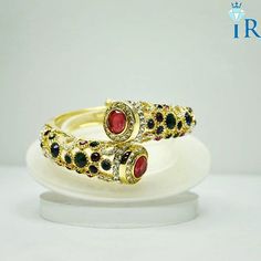 Irubab Red Panther Gold Plated Bracelet. Ultimate Designed Gold Plated Bracelets for all Women and girls Ideal for party wear and wedding occasions Grab Now for great offer price. Call us or WhatsApp us on +919782479919 Hurry Now!! #jewellery #Jewellerys #jewellerydesign  #jewellerygram #jewellerylove #jewellerydesigner #jewelrygram #silverjewellery  #goldenjewelry #instajewelry #fashionjewelry #fashionjewellery #onlinejewellery goldplatedbracelet #goldplatedbracelets #goldenbracelet #goldenb... Golden Jewelry, Gold Plated Bracelets, Types Of Rings, Panther, Party Wear, Jewelry Collection, Silver Jewelry, Gemstone Rings, Gold Plate