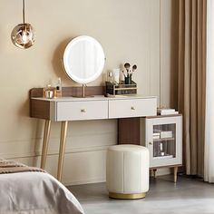 a bedroom with a vanity, mirror and stool