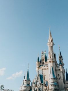 the castle is white and has blue turrets