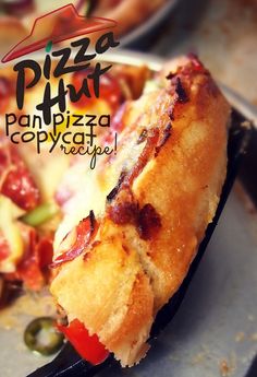 a piece of pizza on a spatula with the words pizza hut written above it