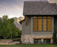 a small house with stone and wood accents