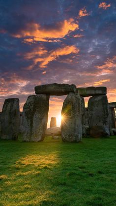 the sun is setting over stonehenge in england