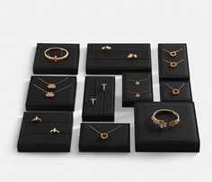 a bunch of jewelry sitting on top of a black box