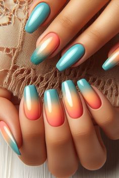 Add a pop of color to your nails with this playful ombre manicure, ideal for any season. Ombre Tropical Nails, Ombre Beach Nails Summer, Gradient Summer Nails, Teal And Pink Ombre Nails, Turquoise Ombre Nails Teal, Coral And Teal Nails Color Combinations, Teal Coral Nails, Coral And Aqua Nails, Blue And Orange Ombre Nails