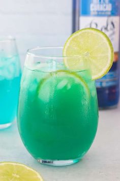 two glasses filled with blue and green liquid