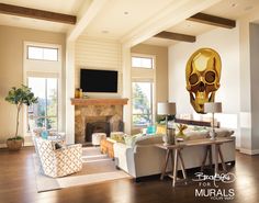 a living room with couches, tables and a skull head mounted to the wall