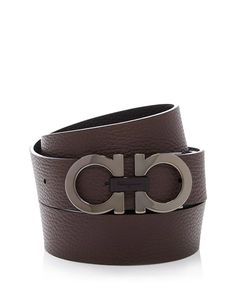 Stand out from the crowd with this versatile belt from Salvatore Ferragamo. Featuring a distinct matte wood-tone Gancini buckle and reversible black or hickory leather, you can switch up your look with just a flip. Crafted in Italy using premium materials, its adjustable design ensures a personalized fit whether with jeans, slacks or suits. Contemporary luxury meets simple style - add this chic yet understated accessory to complete any outfit with Italian flair. Ferragamo Men, Reversible Belt, Contemporary Luxury, Personal Shopping, Salvatore Ferragamo, Leather Belt, Simple Style, Style Icons, Men's Clothing