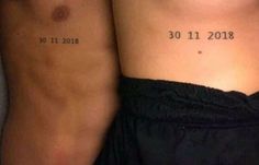 two people with tattoos on their stomachs that read 30 11 2018 and 31 11 2019