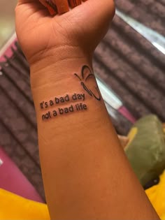 a woman's arm with a tattoo saying it's a bad day not a bad life