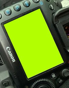 a digital camera with a green screen on it