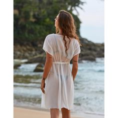 This Bikini Sheer Swimsuits Cover Up is the perfect addition to your summer wardrobe! This lightweight cover-up is made of a sheer, flowy fabric that drapes gracefully over your body. It features a drawstring waist, long bell sleeves, and a ruffled hemline that adds a feminine touch. The adjustable straps allow you to customize the fit to your body, while the open-back design provides extra ventilation for hot summer days. No matter where you are, this cover-up will keep you looking and feeling Beach Season Cover-up With Tie Waist, Casual Sheer Summer Cover-up, Flowy V-neck Swimwear For Beach Cover-up, Summer Beach Cover-up With Tie Waist, Solid V-neck Swim Dress For Vacation, Lightweight V-neck Beach Cover-up, Lightweight V-neck Cover-up For Beachwear, V-neck Beach Dress With Tie Waist For Vacation, Sheer Swimwear For Beach Party