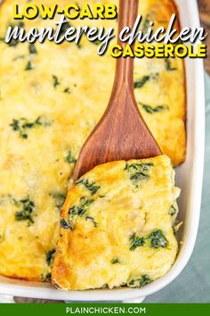 a casserole dish with spinach and cheese in it on a wooden spoon