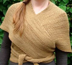 a woman wearing a knitted wrap around her shoulders