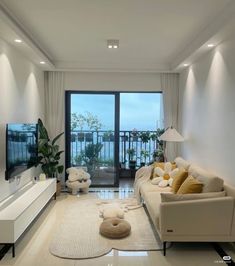 a living room filled with furniture and a flat screen tv