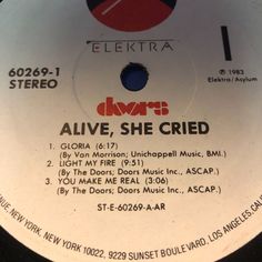 the label for alive, she cried's album on a white record disc