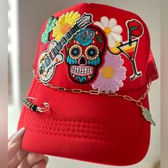 Dia De Los Muertos Sugar Skull Day Of The Dead Patch Trucker Hat Cap With Chain - Handmade, New, Original, One Of A Kind! - 7 Patches (Sugar Skull, Lips & Martini, 3 Flowers, Cactus, Guitar) - Solid Red Snap Back Trucker Hat - Fashion Gold Chain With Cactus Charm, Black Bead Gold Safety Pin Handmade Trucker Hats Are A Huge Trend This Year! I Made Some With So Many Different Styles Take A Look At My Closet And Message Or Comment If You Have Any Questions Or Requests. - Theme Of This Cap Is Day Of Trucker Hats With Patches, Truckers Hats, Hat Charms, Trucker Hat Fashion, Hat Bar, Skull Day Of The Dead, Dope Hats, Patch Hats, Custom Trucker Hats