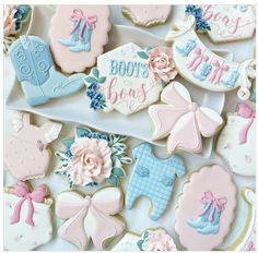 baby shower cookies are arranged on a platter