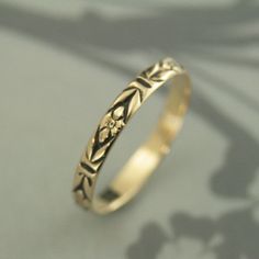 "Gold Antiqued Ring~Gold Wedding Band~Orange Blossom Ring~Romance Band~Antiqued Gold Band~Black Gold Ring~Women Gold Ring~Vintage Style Ring Introducing our new ANTIQUED Gold Bands! This solid 14K gold ring is hand crafted from preformed pattern wire. It features a lovely floral design and can be custom made in any ring size. The detail is so exquisite it looks as if it was hand engraved! Measuring 2.8mm (just under 1/8\") wide and a slim .75mm thick, it is perfect as a petite wedding ring or st Antique Finish Rings For Anniversary, Heirloom Rings With Antique Finish For Anniversary, Vintage Engraved Ring With Antique Finish For Anniversary, Heirloom Style Antique Finish Rings For Anniversary, Antique Finish Anniversary Jewelry Ring, Gold Wedding Ring With Antique Finish, Gold Rings With Antique Finish For Wedding, Vintage Engraved Yellow Gold Flower Ring, Vintage Engraved Stackable Rings With Round Band