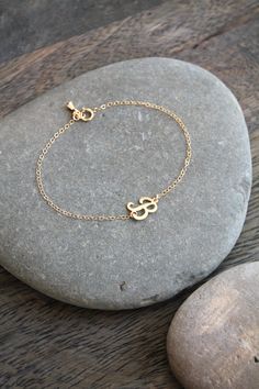 A dainty 14k gold filled bracelet with a script-letter initial, attached sideways on a shimmering chain, with a little teardrop charm by the clasp. Please select initial and size from the drop down menus. Available in the following letters only: A B C D E F H J K L M N P R S Y Components: Script letters - 14k gold filled, aprox 10x8mm each Chain - 14k gold filled Your item will arrive in a beautifully embossed Jewelry box - Ready for gift giving! Custom Name Adjustable 14k Gold Jewelry, Adjustable Monogrammed Gold Jewelry, Adjustable Everyday Jewelry With Initials, Everyday Adjustable Jewelry With Initials, Minimalist Adjustable Custom Name Jewelry, Adjustable Initials Pendant Jewelry, Adjustable Initial Pendant Jewelry, Dainty Adjustable Name Bracelet With Initials, Dainty Adjustable Bracelet With Initials