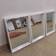 three mirrors are placed next to each other on the floor