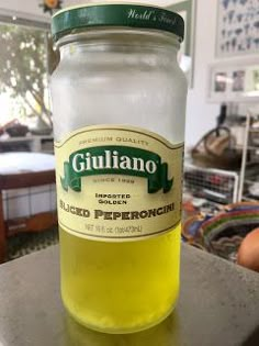 a glass jar filled with liquid sitting on top of a counter