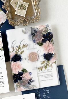 the wedding stationery is laid out on top of each other, including an envelope