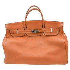 Brand: Hermès Style: Birkin Size: 50cm Color: Gold Material: Togo Leather Hardware: Palladium Hardware (PHW) Dimensions: 19.5" W x 17" H x 10.5" D Handle Drop: 4.5" Designer Brown Bag With Hasp Closure, Designer Shoulder Bag With Hasp Closure For Travel, Shopping Bag With Silver-tone Hardware In Epsom Leather, Epsom Leather Bags With Silver-tone Hardware For Shopping, Luxury Orange Bags With Silver-tone Hardware, Brown Epsom Leather Bag With Handles, Luxury Satchel With Hasp Closure For Shopping, Formal Orange Shoulder Bag With Palladium Hardware, Brown Epsom Leather Bag