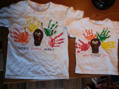 two children's t - shirts with handprints on them