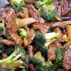 broccoli and meat on a plate with sauce