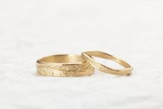 14k Solid Gold Wedding Bands His and Hers, Matching Wedding Rings, Floral Band I got the inspiration for these rings while I walked in the field outside of my studio Dainty 14K yellow gold engraved leaves Ring, handmade with great attention to detail, each leaf is engraved by hand to create this endless feeling of elegance design, the slight organic structure of this ring makes it so unique and special. ❀ A perfect engagement or wedding gift to your loved ones. Features: woman Band: ❇ The band i Classic 14k Stamped Couple Rings For Wedding, Classic Couple Rings Stamped 14k For Wedding, Classic 14k Gold Couple Rings For Wedding, Heirloom Wedding Couple Rings Stamped 14k, Heirloom 14k Gold Wedding Bands, Elegant 14k Stamped Couple Rings For Wedding, Yellow Gold 14k Stamped Wedding Couple Rings, Gold Heirloom Bridal Sets For Anniversary, Heirloom Gold Bridal Sets For Anniversary