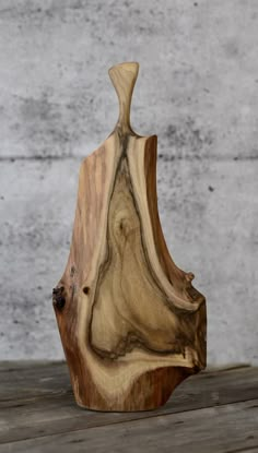 a wooden object sitting on top of a table