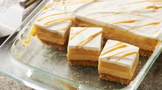 several pieces of cake sitting on top of a glass pan