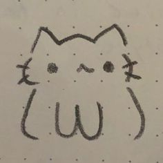 a drawing of a cat's face with the word w on it in black ink