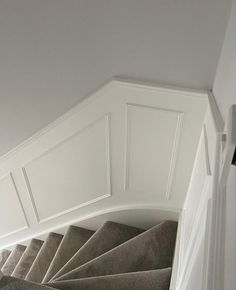 an image of a staircase going up the side of a house with carpeted stairs