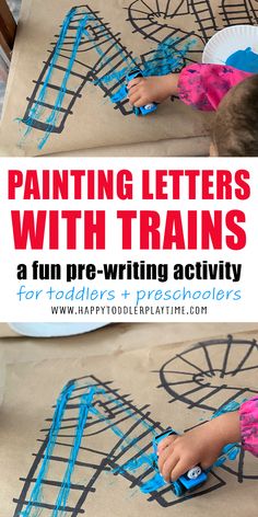 a young child is painting letters with train tracks