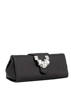 The Anthea clutch in silk satin, with magnetic closure, is enriched with a jeweled Art Deco-inspired brass buckle, embellished with baguette and square cut crystals which have been applied by hand. Can be carried by hand or worn over the shoulder thanks to the shoulder chain. Color: Black 900 Made in Italy All handbags and accessories are considered final sale and may not be returned or exchanged. PLEASE NOTE ALL SALE ITEMS ARE FINAL SALE Satin Clutch, Shoulder Chain, Brass Buckle, Square Cut, Art Deco Inspired, Magnetic Closure, Silk Satin, Sale Items, Final Sale