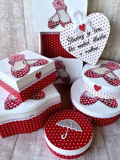 some red and white boxes are stacked on top of each other with an umbrella in the middle