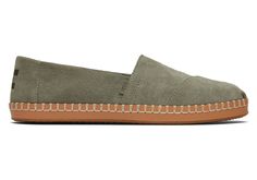 A dressed-up spin on our classic slip-on Alpargata. Designed in a dreamy palette of suedes with artisanal stitch detailing on a luxe leather wrap for an elevated touch. Perfect for the office, evenings out, and even more formal occasions. | Suede uppers. TOMS leather products support responsible manufacturing via the Leather Working Group. Removable OrthoLite® Eco LT-Hybrid™ insole for enhanced comfort and breathability made with 26% eco content including 15% hybrid materials, 6% bio-oil and 5% Summer Workwear Suede Slip-ons, Spring Suede Slip-ons With Leather Footbed, Everyday Suede Slip-ons With Cushioned Footbed, Suede Slip-ons For Summer Workwear, Brown Suede Slip-ons For Spring, Classic Slip-ons With Suede Lining For Spring, Spring Slip-ons With Suede Lining, Dreamy Palette, Bio Oil