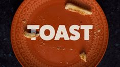 a plate with toast on it and the word toast written in white across the top